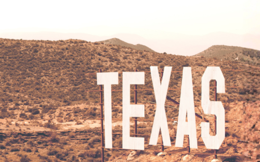 Texas landscape with large Texas sign representing real estate market trends in 2026