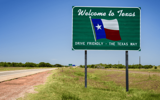 Welcome to Texas road sign symbolizing migration and population growth driving Texas real estate demand